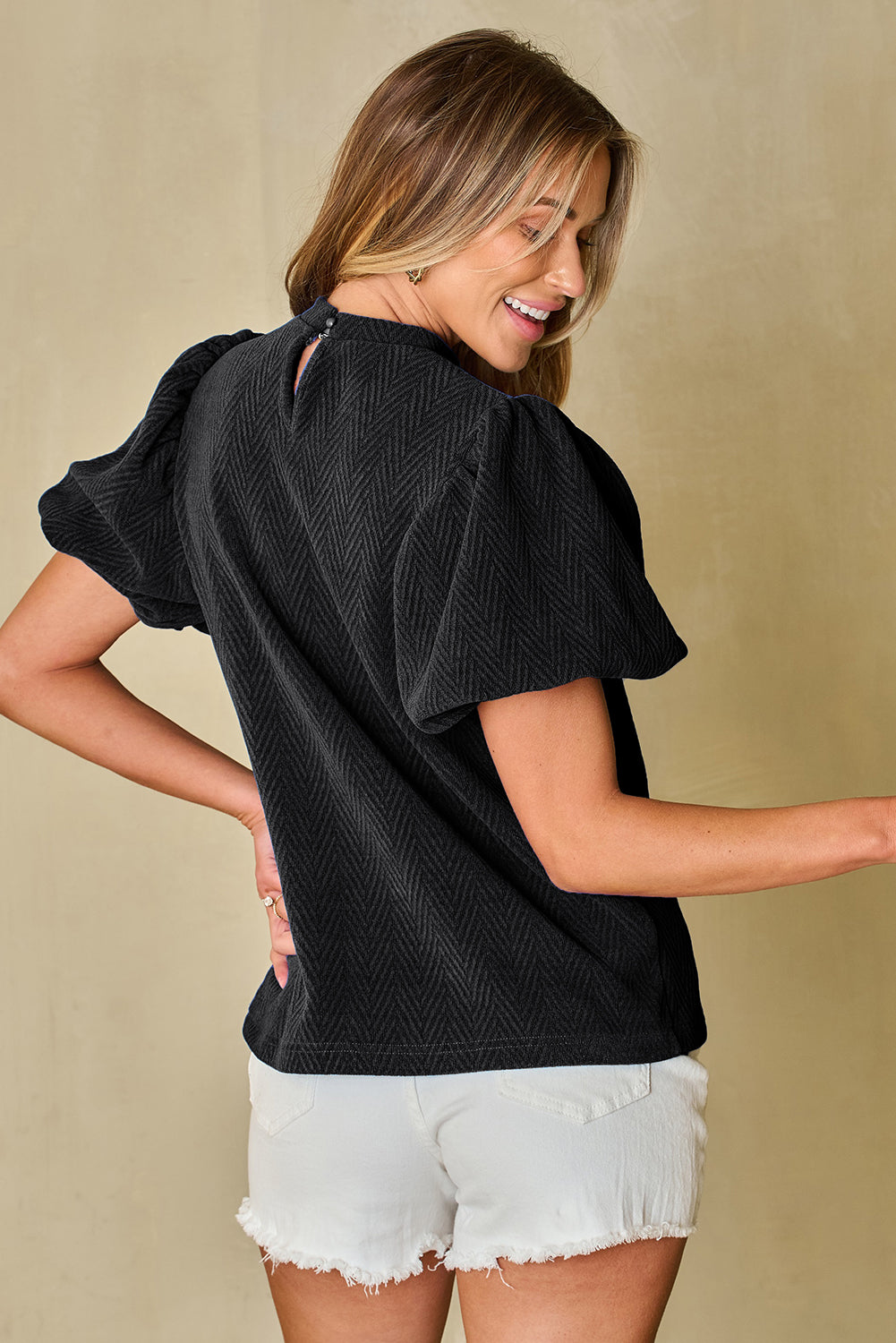 Blusa con cuello redondo y manga abullonada