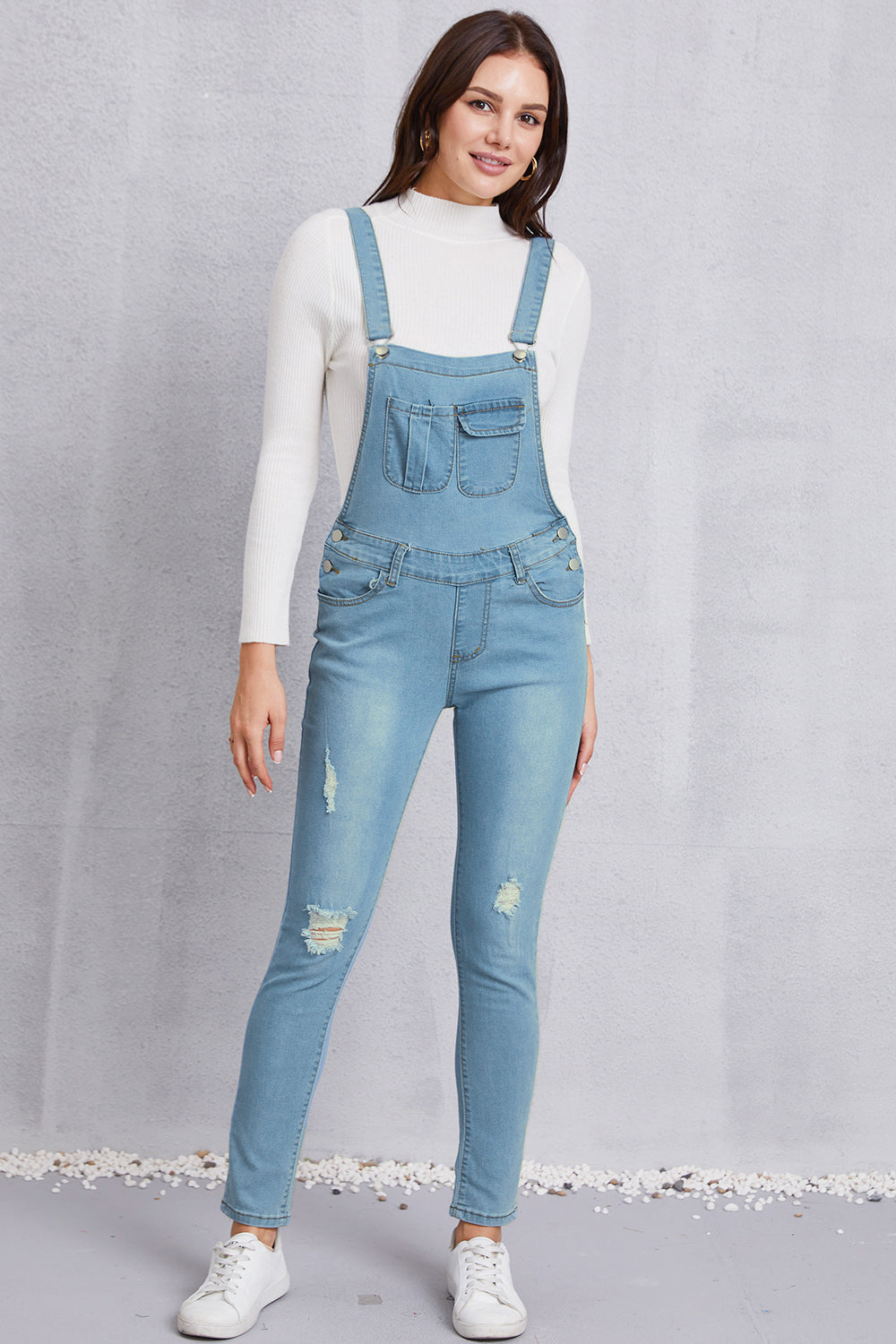 Overall aus gewaschenem Denim im Used-Look mit Taschen