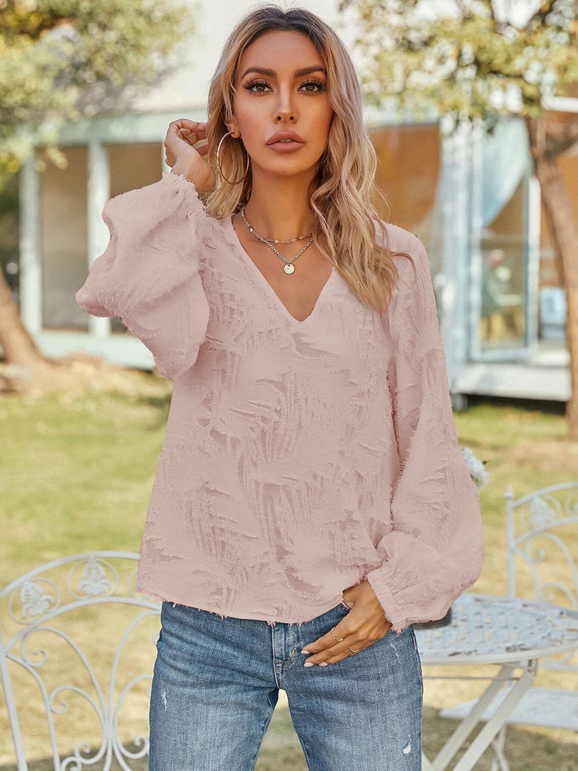 Blusa de manga larga con cuello en V