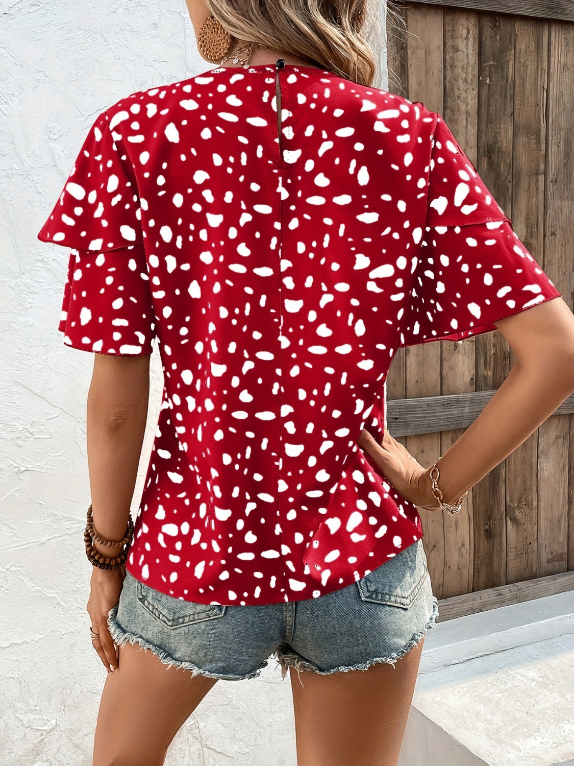 Blusa estampada de manga corta con cuello redondo