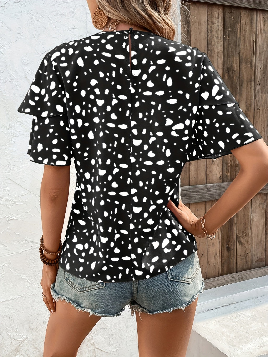 Blusa estampada de manga corta con cuello redondo