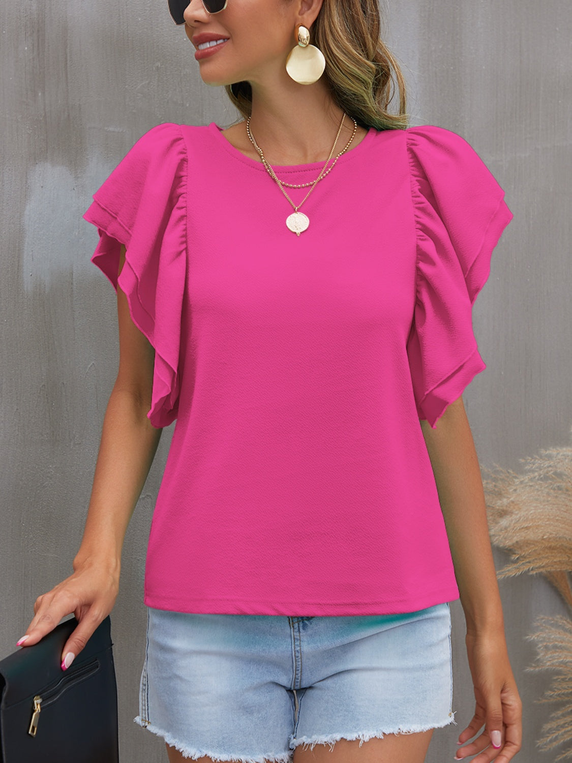 Blusa con cuello redondo y mangas con volantes