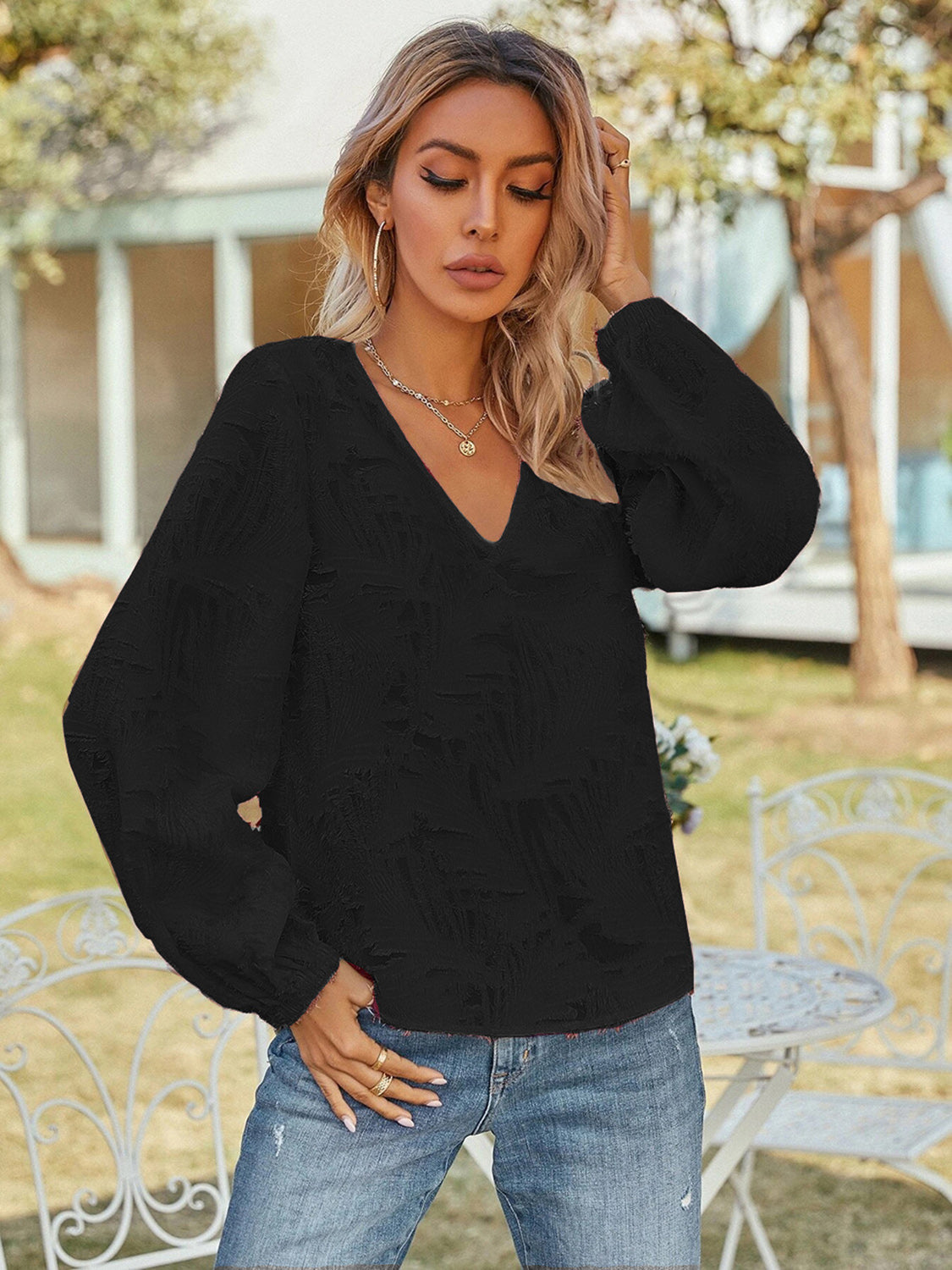 Blusa de manga larga con cuello en V