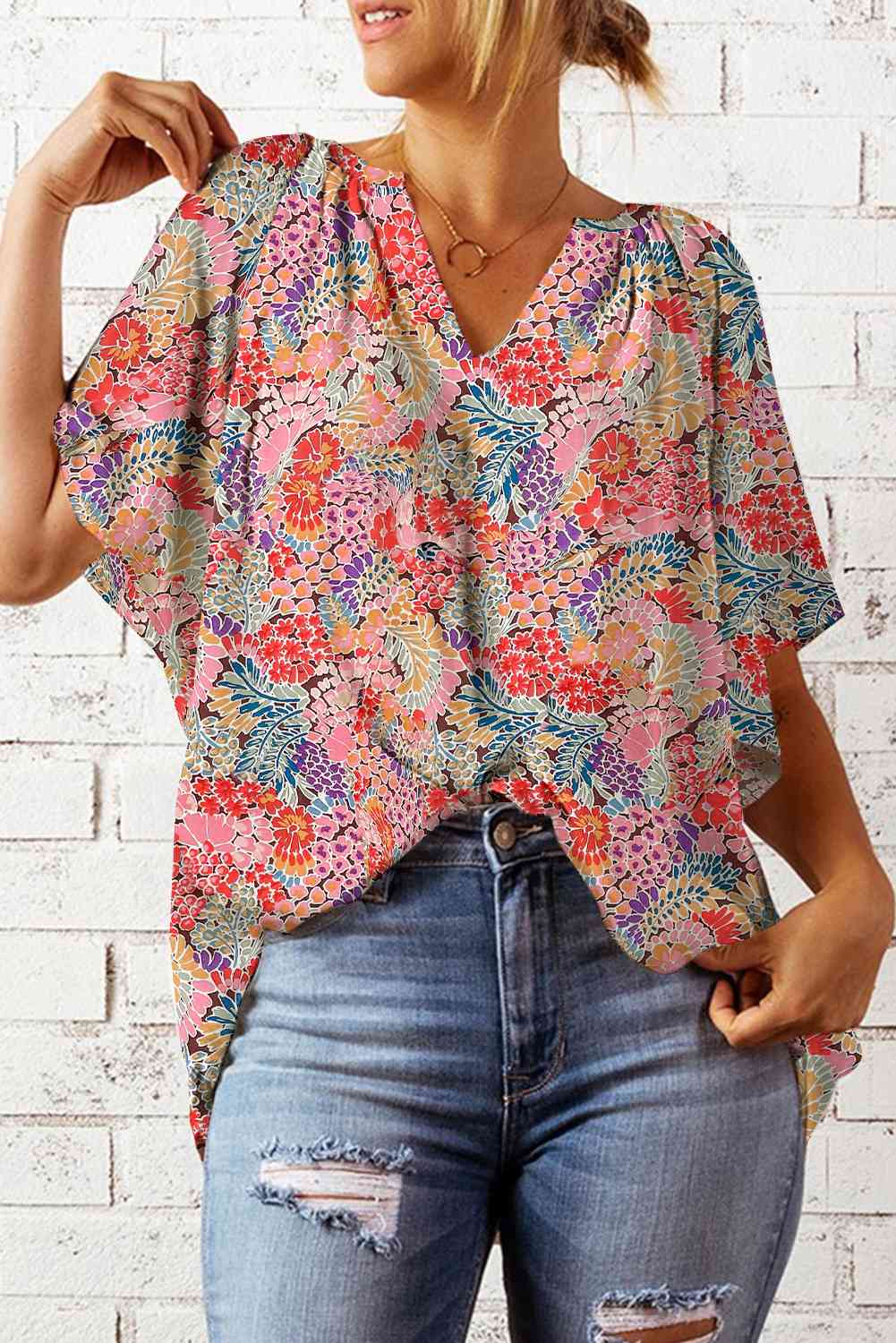 Bluse mit Blumenmuster, Reverskragen und Flatterärmeln