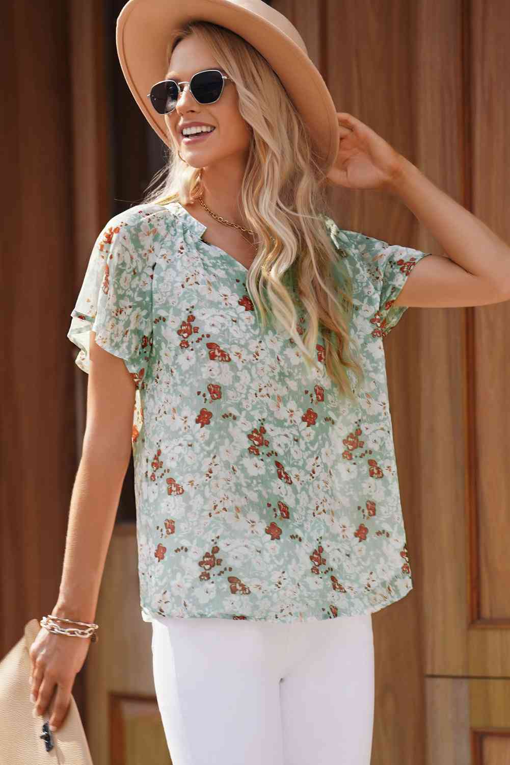 Bluse mit Blumenmuster, Reverskragen und Flatterärmeln