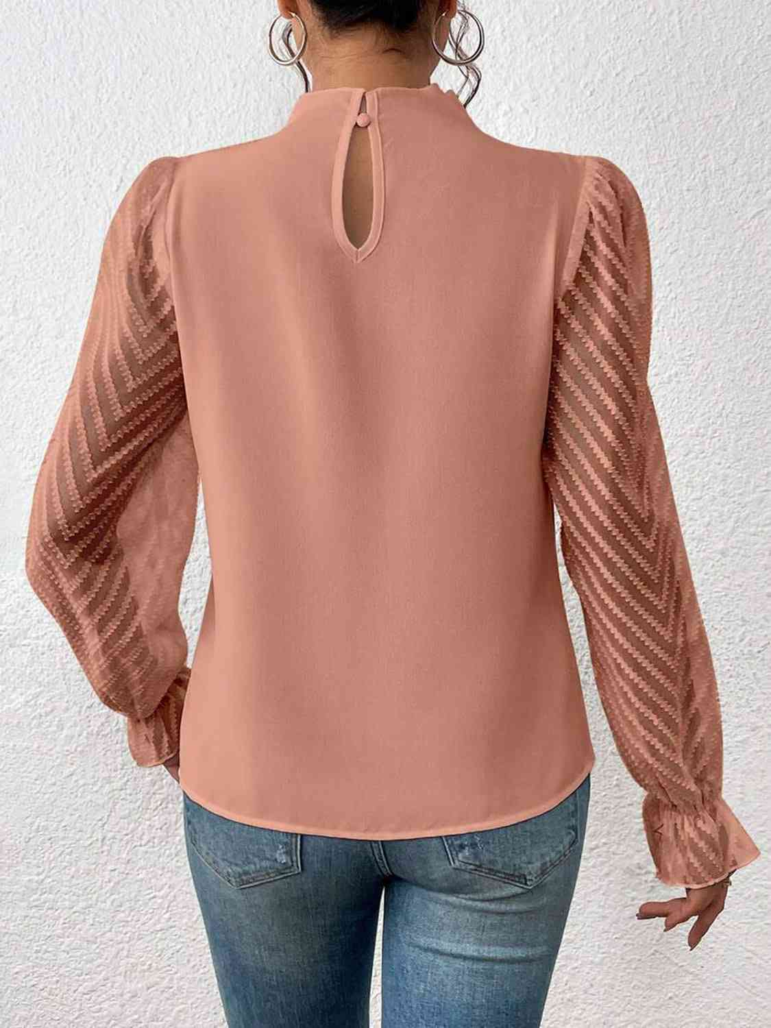 Bluse mit Rollkragen und Volantärmeln