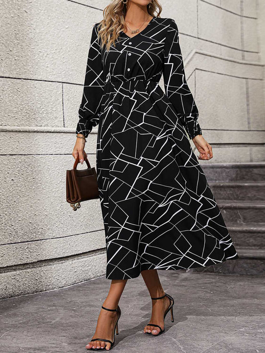 Kleid mit geometrischem V-Ausschnitt und Laternenärmeln