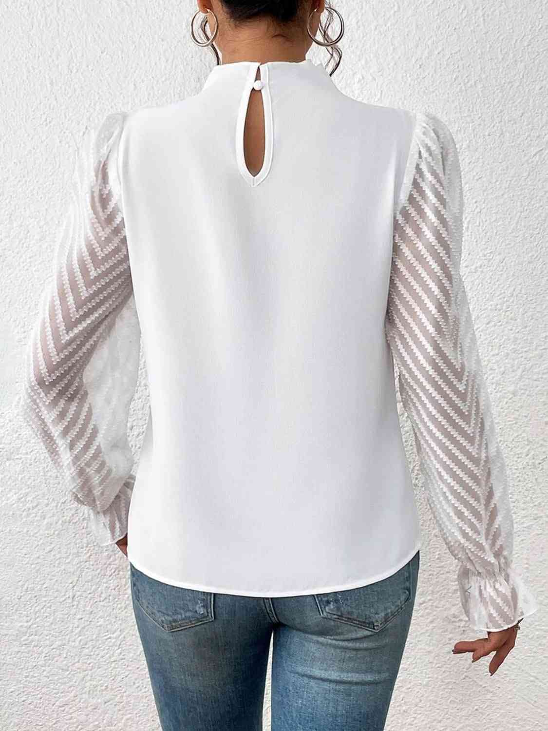 Bluse mit Rollkragen und Volantärmeln