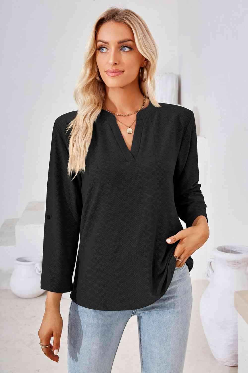 Bluse mit V-Ausschnitt und Rollärmeln