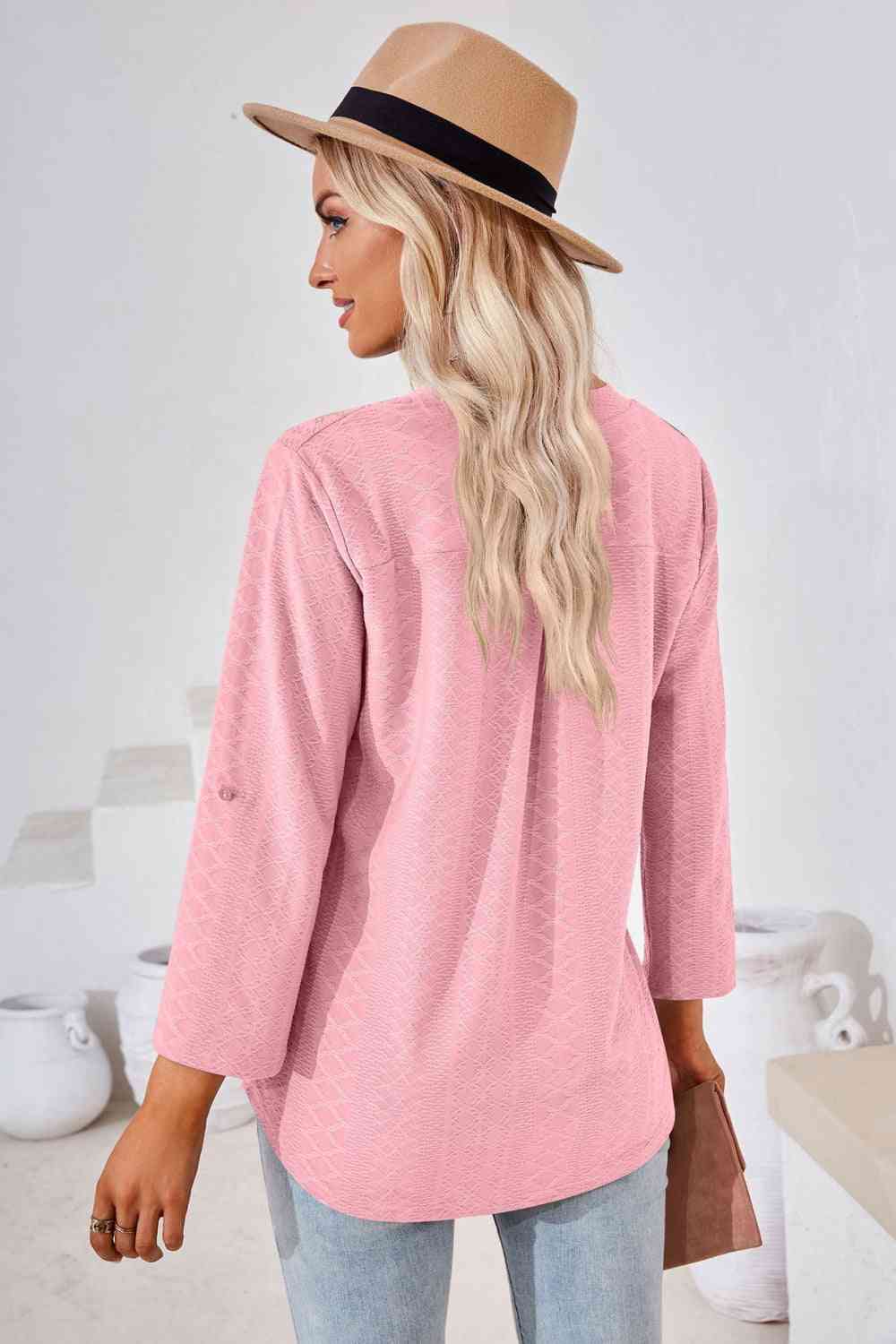 Bluse mit V-Ausschnitt und Rollärmeln